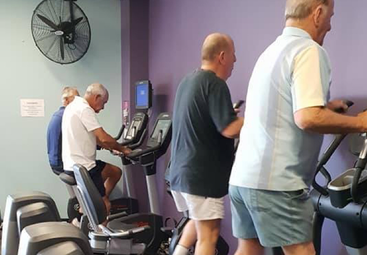 A group of elderly people exercising